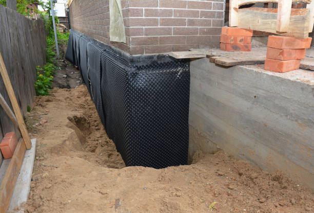 Happy homeowners after waterproofing job in New Goshen